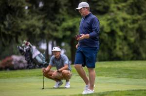 Jacob Rohde surveys the area at Everett Golf & Country Club during last years final round of the Snohomish County Amateur golf tournament. The three-time champion is among this years favorites. (Annie Barker / The Herald)