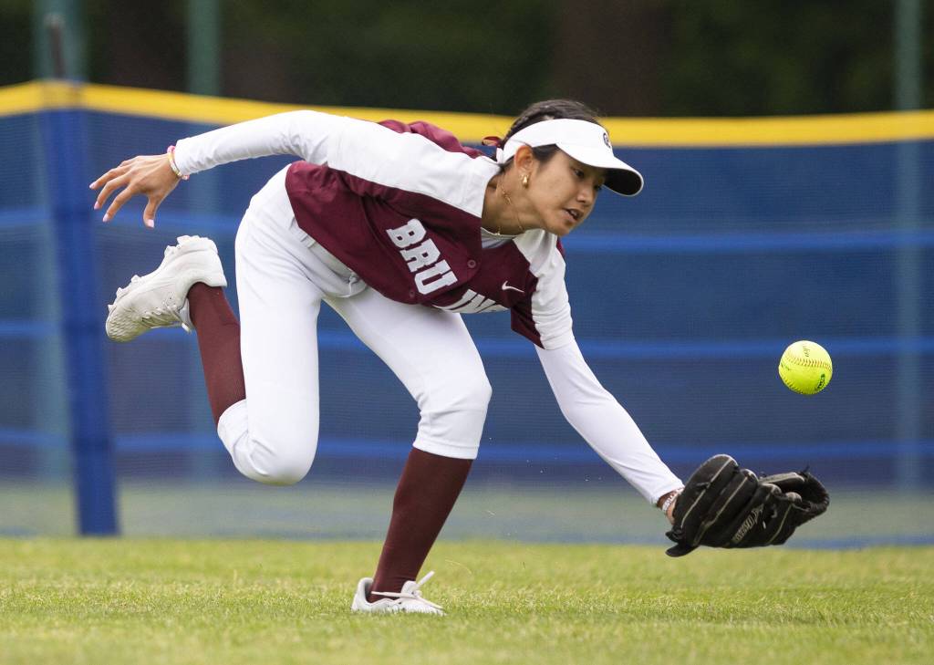 Cascades Lexie Lee reaches out to try and field the ball in the outfield during the 3A state softball tournament game against Gig Harbor on Thursday, May 23, 2024 in Lacey, Washington. (Olivia Vanni / The Herald)