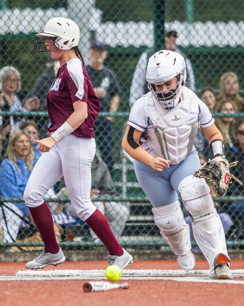Cascades Sophia Tripp makes a face after just making it to home plate to score during the 3A state softball tournament game against Gig Harbor on Thursday, May 23, 2024 in Lacey, Washington. (Olivia Vanni / The Herald)