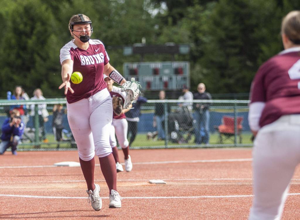 Cascades Mia Walker smiles as she tosses the ball to first base for the final out to win the game against Gig Harbor on Thursday, May 23, 2024 in Lacey, Washington. (Olivia Vanni / The Herald)