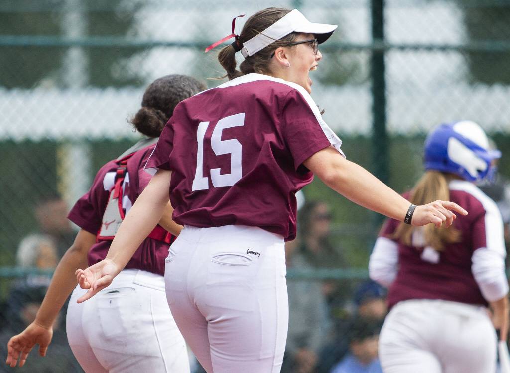 Cascades Leah Tacher celebrates teammate Sophia Tripps home run during the 3A state softball tournament game against Gig Harbor on Thursday, May 23, 2024 in Lacey, Washington. (Olivia Vanni / The Herald)