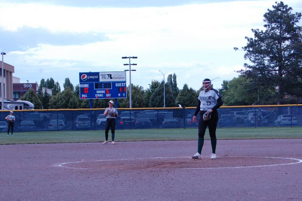 Jacksons Yanina Sherwood smiles with her team leading 11-0 in second round of the Class 4A state playoffs May 24 at Columbia Playfields in Richland, WA (Aaron Coe / The Herald).