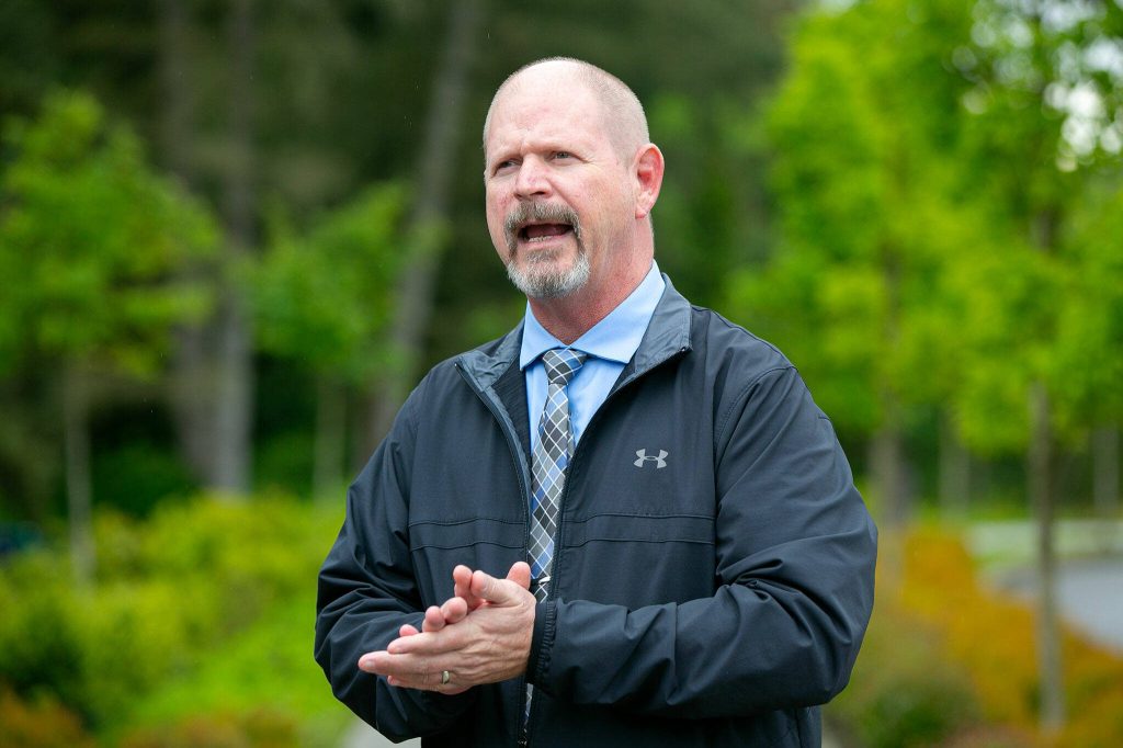 City Manager Jeff Niten speaks to a group during a tour and discussion with community leaders regarding the Mountlake Terrace Main Street Revitalization project on Tuesday, May 28, 2024, in Mountlake Terrace, Washington. (Ryan Berry / The Herald)