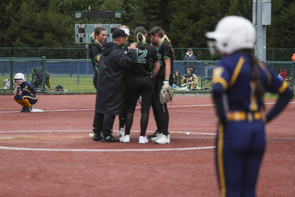 Everett players wait nervously during a 3A softball game between Everett and Roosevelt at the regional athletic complex in Lacey, Washington on Friday, May 24, 2024. Everett fell in the eighth, 7-8. (Annie Barker / The Herald)
