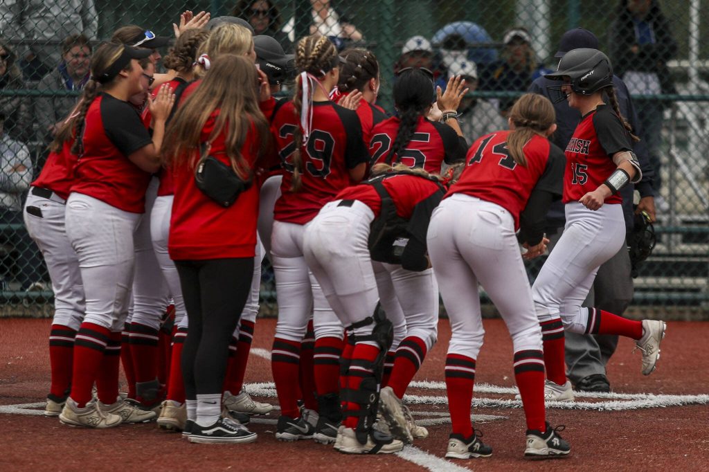 Snohomish players celebrate a home run by Camryn Sage (15) during a 3A softball game between Snohomish and Seattle Prep at the regional athletic complex in Lacey, Washington on Friday, May 24, 2024. Snohomish won, 8-0. (Annie Barker / The Herald)