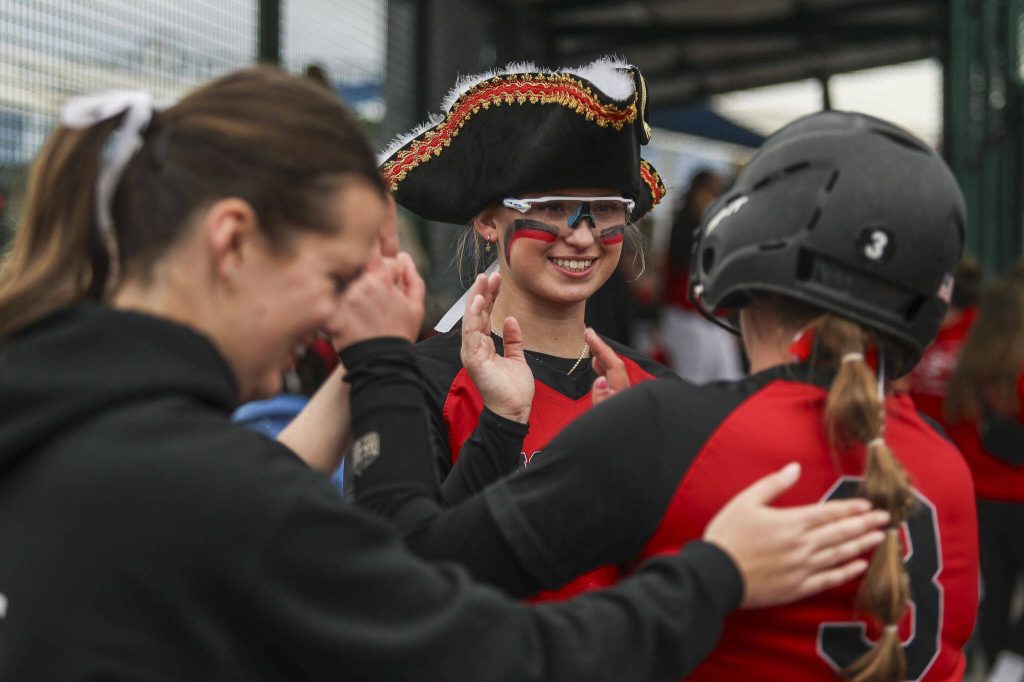 Snohomish players high-five during a 3A softball game between Snohomish and Seattle Prep at the regional athletic complex in Lacey, Washington on Friday, May 24, 2024. Snohomish won, 8-0. (Annie Barker / The Herald)