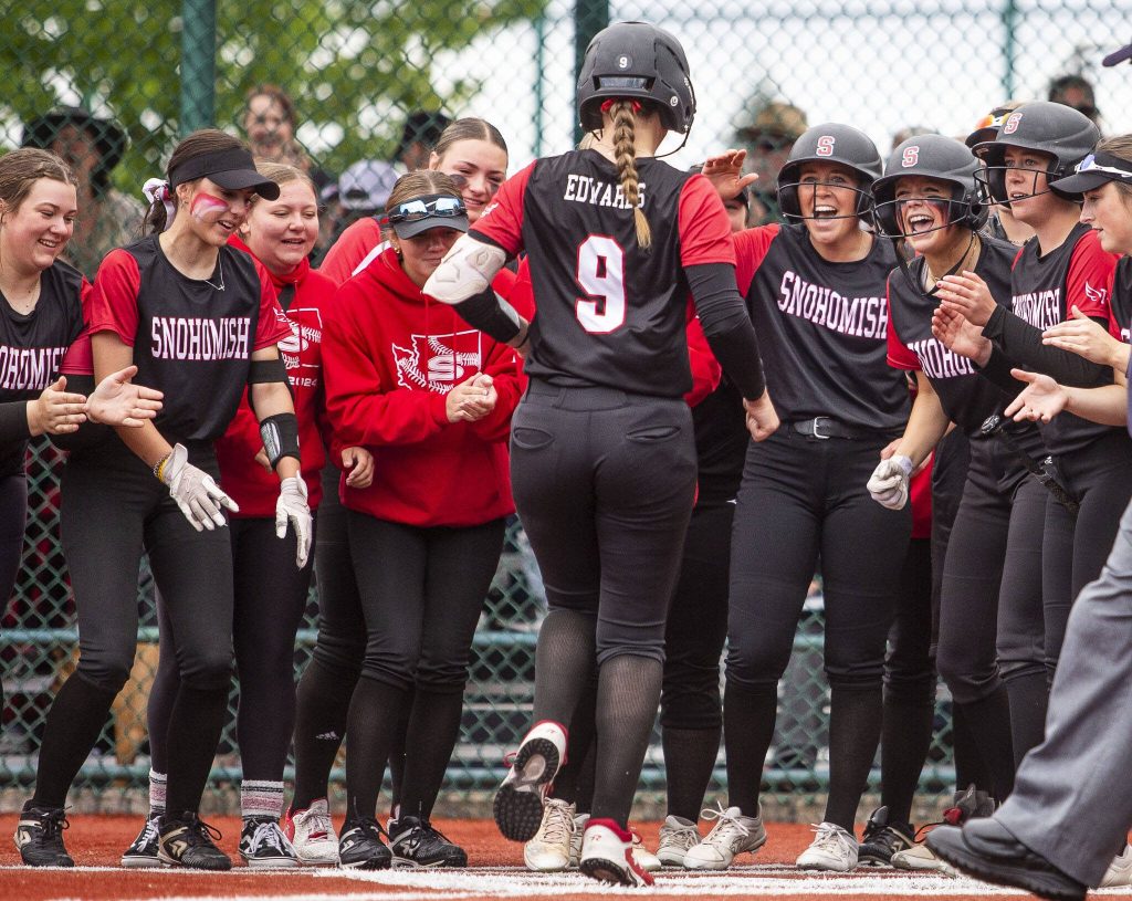 Snohomishs Abby Edwards scores after hitting a home run during the 3A state softball semifinal game against Garfield on Saturday, May 25, 2024 in Lacey, Washington. (Olivia Vanni / The Herald)
