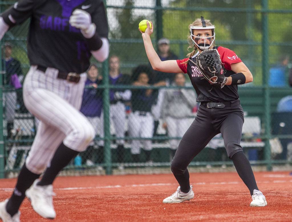 Snohomishs Alexandra Flohr throws the ball to first for an out during the 3A state softball semifinal game against Garfield on Saturday, May 25, 2024 in Lacey, Washington. (Olivia Vanni / The Herald)