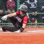 Snohomishs Alexandra Flohr slides into home to score during the 3A state softball semifinal game against Garfield on Saturday, May 25, 2024 in Lacey, Washington. (Olivia Vanni / The Herald)
