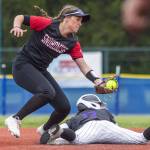 Snohomishs Camryn Sage tries to tag out a Garfield player sliding into second base during the 3A state softball semifinal game against Garfield on Saturday, May 25, 2024 in Lacey, Washington. (Olivia Vanni / The Herald)