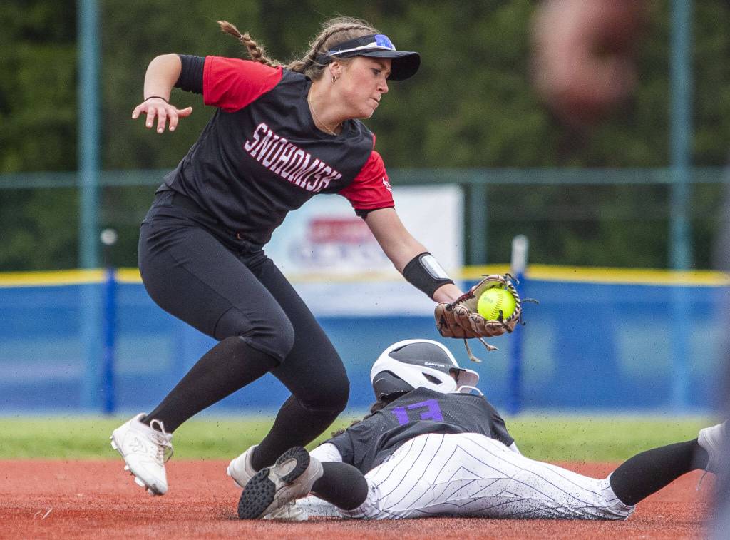 Snohomishs Camryn Sage tries to tag out a Garfield player sliding into second base during the 3A state softball semifinal game against Garfield on Saturday, May 25, 2024 in Lacey, Washington. (Olivia Vanni / The Herald)