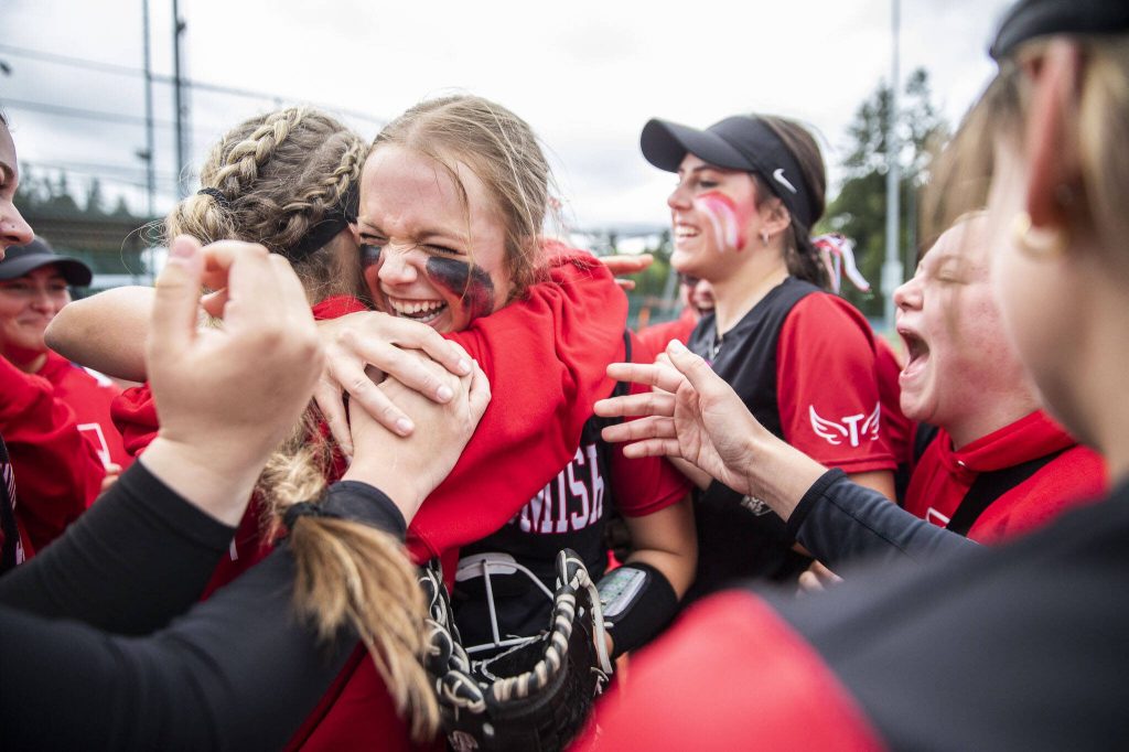 Snohomish players celebrate beating Garfield in the 3A state softball semifinal game to advance to the championship on Saturday, May 25, 2024 in Lacey, Washington. (Olivia Vanni / The Herald)