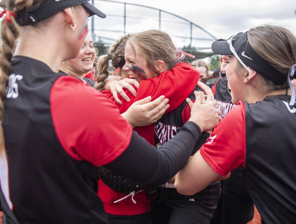 Snohomish players celebrate beating Garfield in the 3A state softball semifinal game to advance to the championship on Saturday, May 25, 2024 in Lacey, Washington. (Olivia Vanni / The Herald)