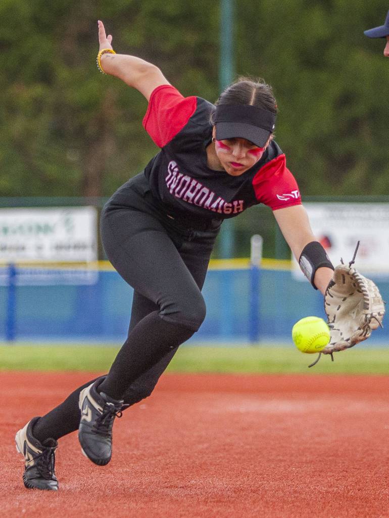 Snohomishs Hannah Siegler reaches out to field a ball during the 3A state softball semifinal game against Garfield on Saturday, May 25, 2024 in Lacey, Washington. (Olivia Vanni / The Herald)