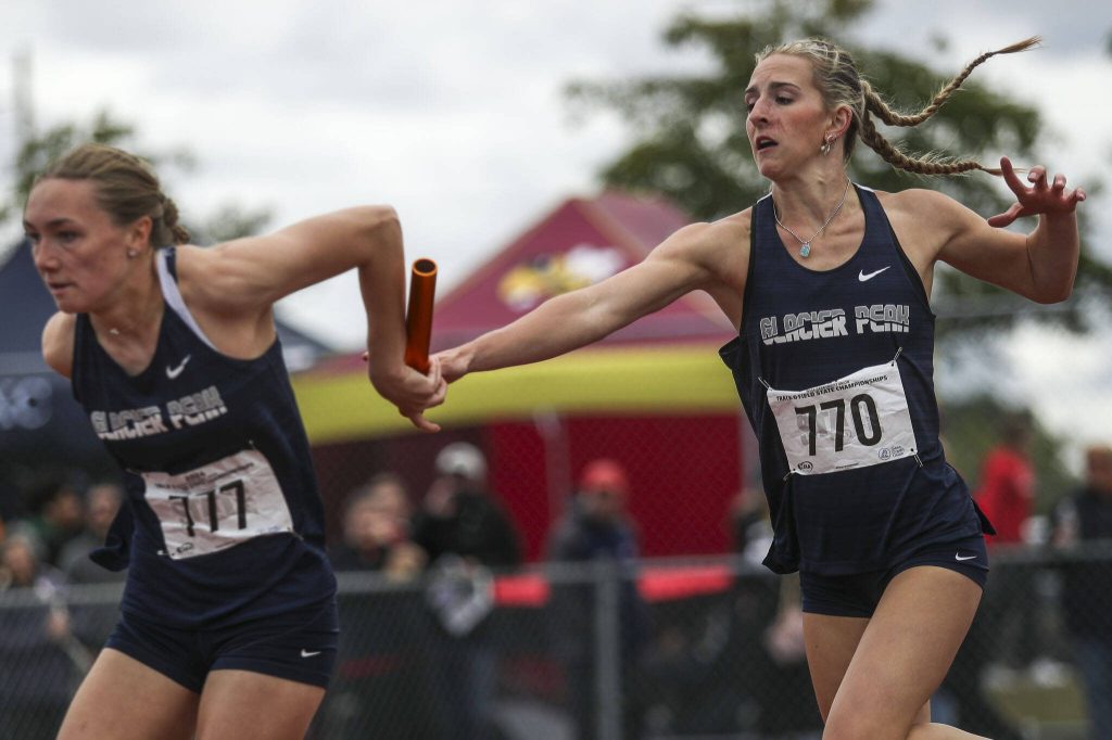 Glacier Peak runners participate in the Girls 4x100M 4A relay during the Class 4A, 3A, 2A track and field state championships at Mount Tahoma High School in Tacoma, Washington on Saturday, May 25, 2024. (Annie Barker / The Herald)