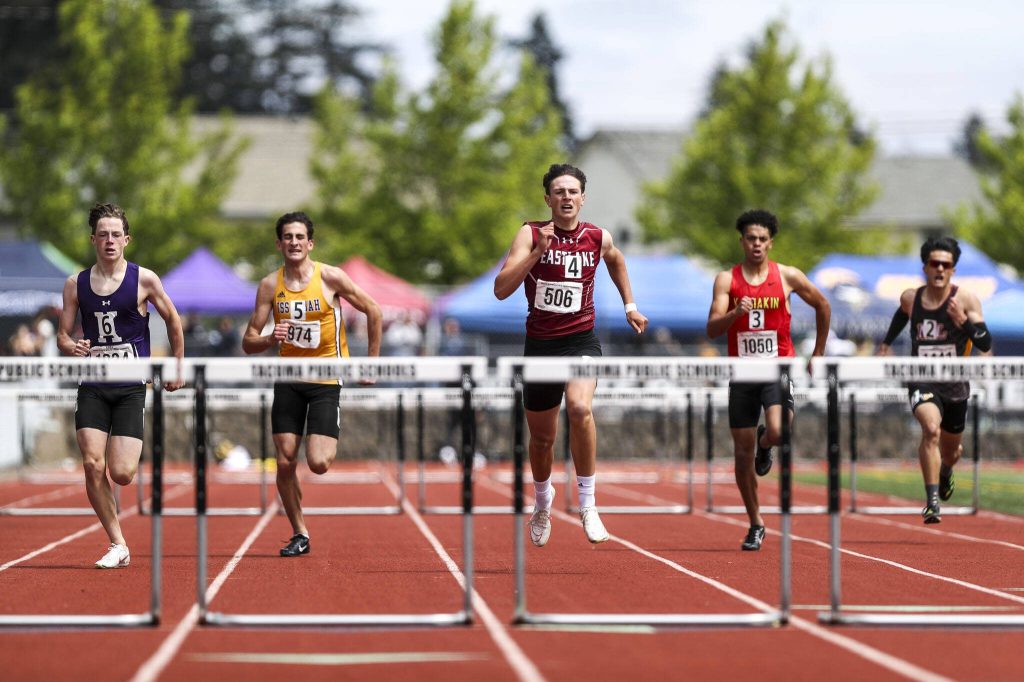 Runners participate in the Boys 300M 3A hurdle race during the Class 4A, 3A, 2A track and field state championships at Mount Tahoma High School in Tacoma, Washington on Saturday, May 25, 2024. (Annie Barker / The Herald)