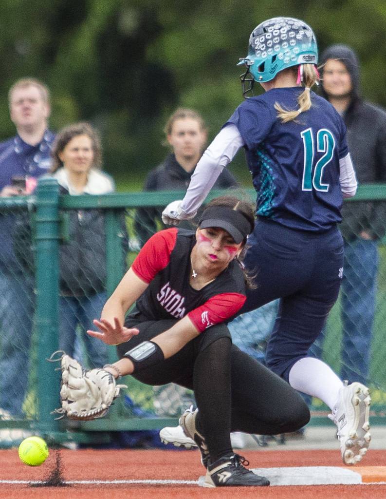 Snohomishs Hannah Siegler misses a catch at first base during the 3A state softball championship game against Auburn Riverside on Saturday, May 25, 2024 in Lacey, Washington. (Olivia Vanni / The Herald)
