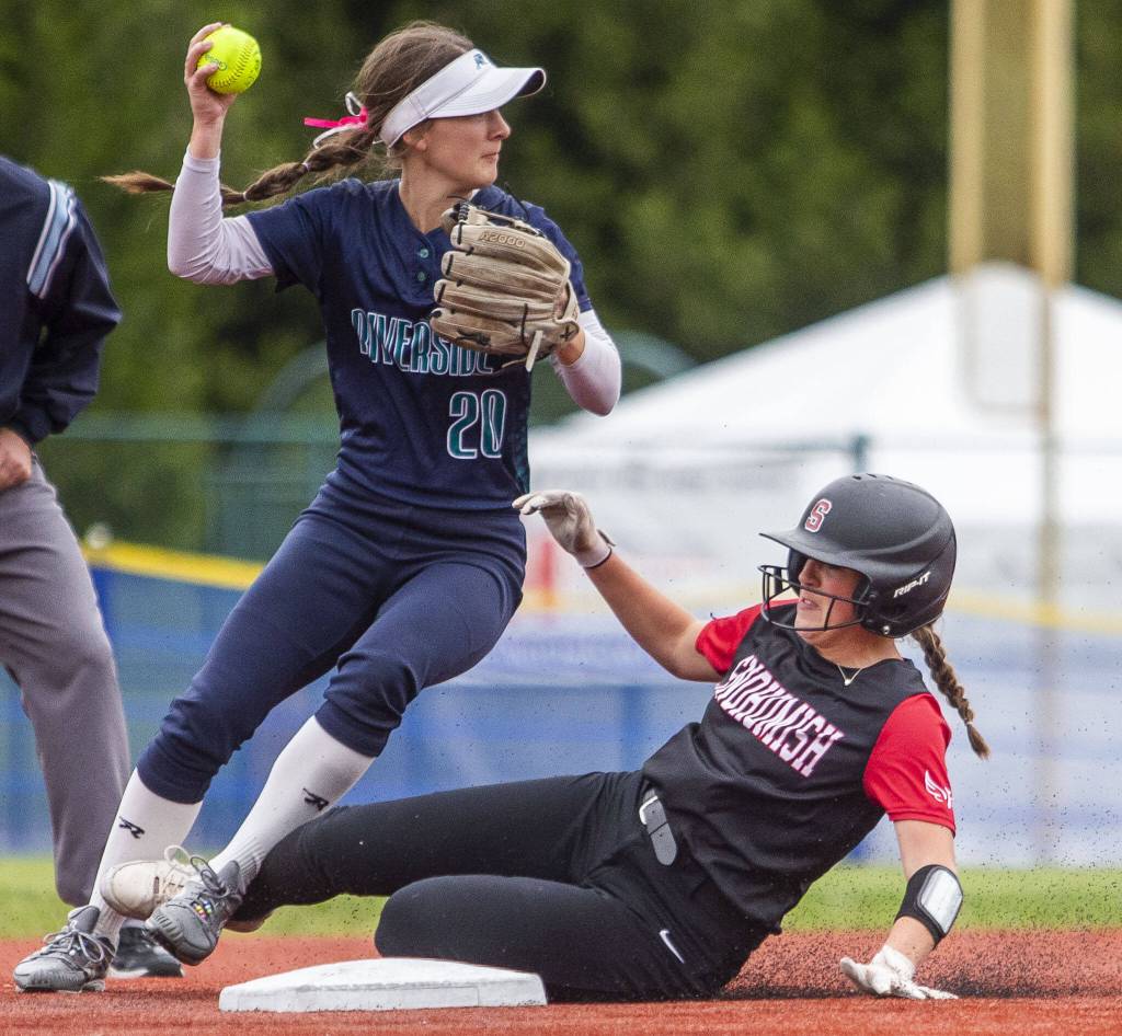 Snohomishs Camryn Sage collides with Auburn Riversides Jossy Taylor while sliding into second base during the 3A state softball championship game against Auburn Riverside on Saturday, May 25, 2024 in Lacey, Washington. (Olivia Vanni / The Herald)