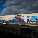 Traffic moves along Highway 526 in front of Boeings Everett Production Facility on Nov. 28, 2022, in Everett, Washington. (Olivia Vanni / The Herald)