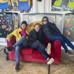 Daily Herald colleagues Brenda Mann Harrison, left, Andrea Brown, center, and Janice Podsada, right, began their razor clamming adventure from the Everett area in Washington to the Pacific Coast on March 13. Their first stop on the road was Eastside Big Tom, a landmark burger destination in Olympia, with a dinosaur and retro theme. (Jacqueline Allison / Special to The Herald)