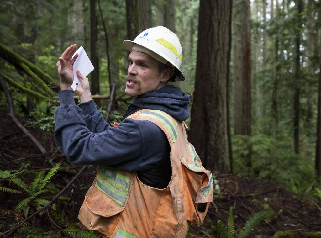 Greg Morrow, a state lands geologist, talks about different identifiers of landslide activity on Wednesday, May 29, 2024 in Arlington, Washington. (Olivia Vanni / The Herald)