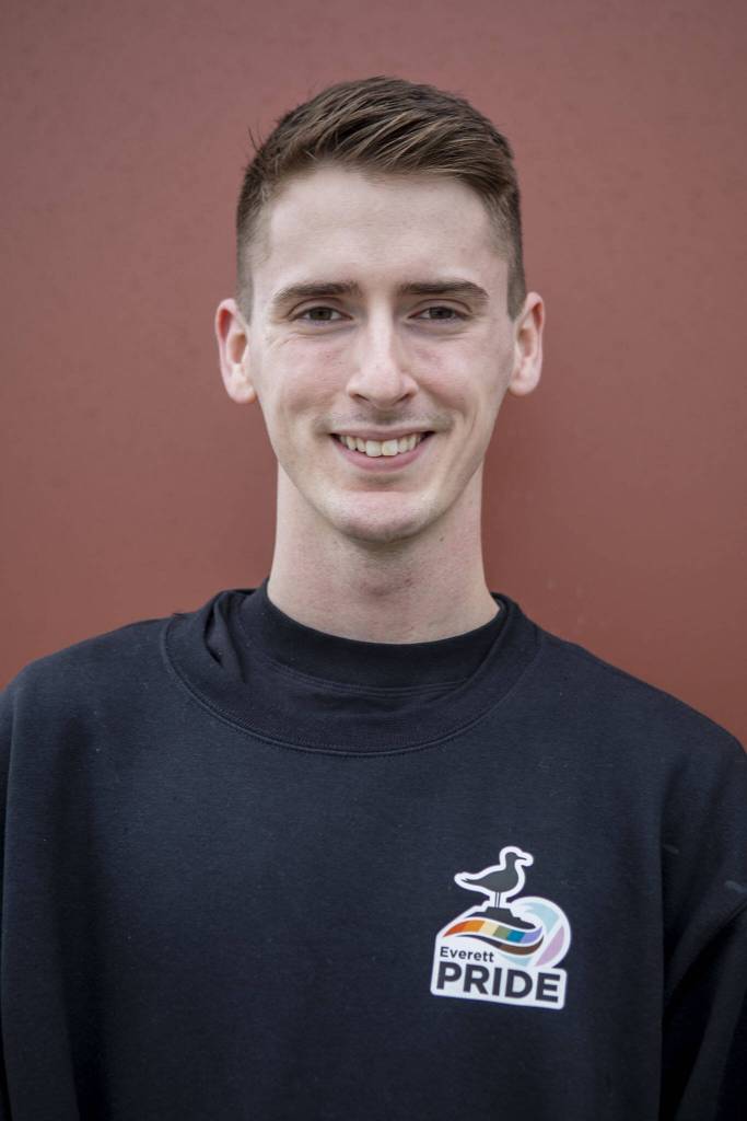 Everett Pride board member Bryce Laake poses for a photo at South Fork Bakery in Everett, Washington on Sunday, May 26, 2024. (Annie Barker / The Herald)
