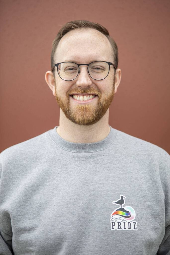 Everett Pride board member Kevin Daniels poses for a photo at South Fork Bakery in Everett, Washington on Sunday, May 26, 2024. (Annie Barker / The Herald)