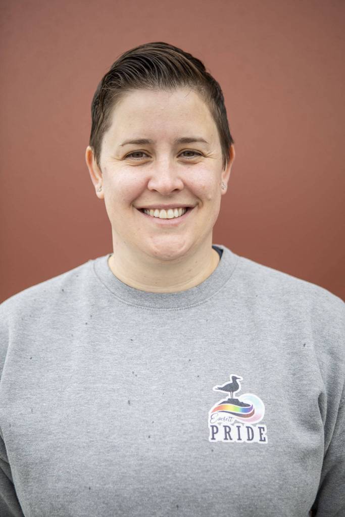 Everett Pride board member Ashley Turner poses for a photo at South Fork Bakery in Everett, Washington on Sunday, May 26, 2024. (Annie Barker / The Herald)