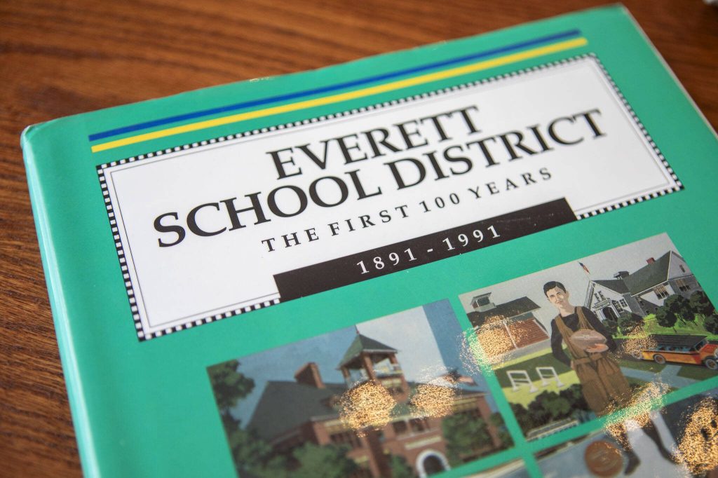 A copy of the Everett School District The First 100 Years by Lawrence E. ODonnell is displayed at his brother Jacks home in Everett, Washington on Wednesday, May 29, 2024. (Annie Barker / The Herald)