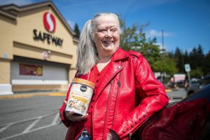 Louise Grevstad, 79, with her free ice cream outside of Safeway on Thursday, May 30, 2024, in Lynnwood, Washington. (Olivia Vanni / The Herald)