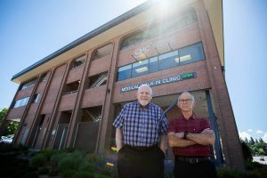 Dr. Scott Macfee and Dr. Daniel Goodman outside of the Community Health Center on Wednesday, June 12, 2024 in Everett, Washington. (Olivia Vanni / The Herald)