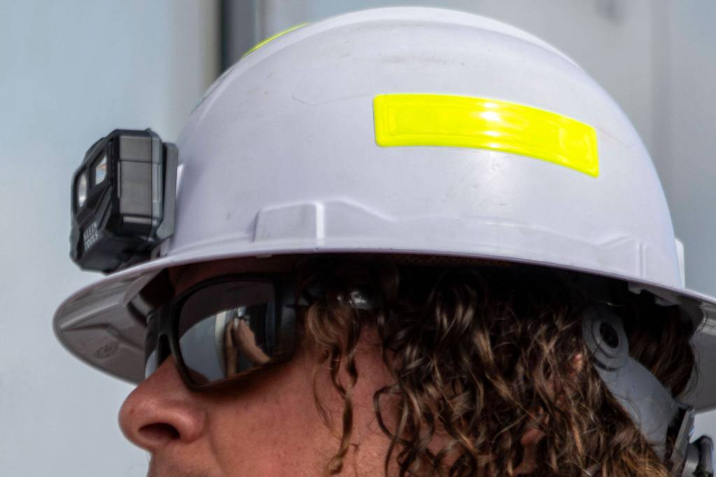 PUD employee Kyle Tucker opens part of the breaker system at the Jennings Park Substation in Marysville, Washington on Wednesday, June 5, 2024. (Annie Barker / The Herald)