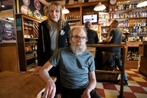 Fred’s Rivertown Alehouse owners Mark and Ginger Nuss at the “staff table” inside the alehouse on Tuesday, June 4, 2024 in Snohomish, Washington. (Olivia Vanni / The Herald)