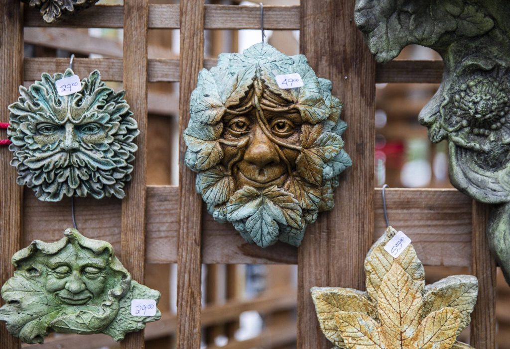 A selection of ceramic faces on display during the first day of Sorticulture on Friday, June 9, 2023 in Everett, Washington. (Olivia Vanni / The Herald)