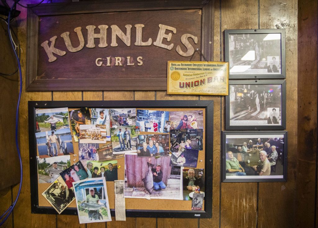 Photos cover a wall at Kuhnles Tavern on June 17, 2024 in Marysville. (Olivia Vanni / The Herald)