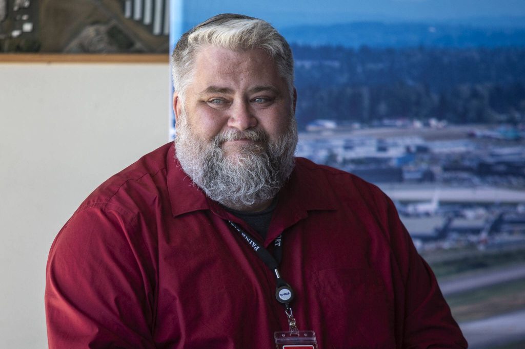 Paine Field Airport Director Josh Marcy speaks during a roundtable discussion at the Paine Field Airport Maintenance Department in Everett, Washington on Thursday, June 6, 2024. Members of the industry discussed how the FAA Reauthorization bill, signed into law last month, is expected to benefit Paine Field. (Annie Barker / The Herald)