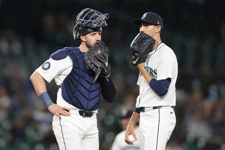 Catcher Mitch Garver (18) and pitcher George Kirby (68) react on May 29 during a game against the Houston Astros at T-Mobile Park in Seattle. (Steph Chambers / Getty Images, file)