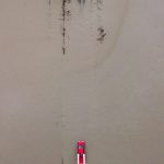 A red truck navigates through floodwaters covering 28th Avenue NW along Pioneer Highway on Wednesday, Dec. 6, 2023 in Stanwood, Washington. (Olivia Vanni / The Herald)