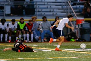 Everett’s J’aiden Cranwell-Meneses leaves a Monroe defender in the dirt while advancing the ball during a 3A District soccer match on Thursday, May 2, 2024, at Monroe High School in Monroe, Washington. (Ryan Berry / The Herald)