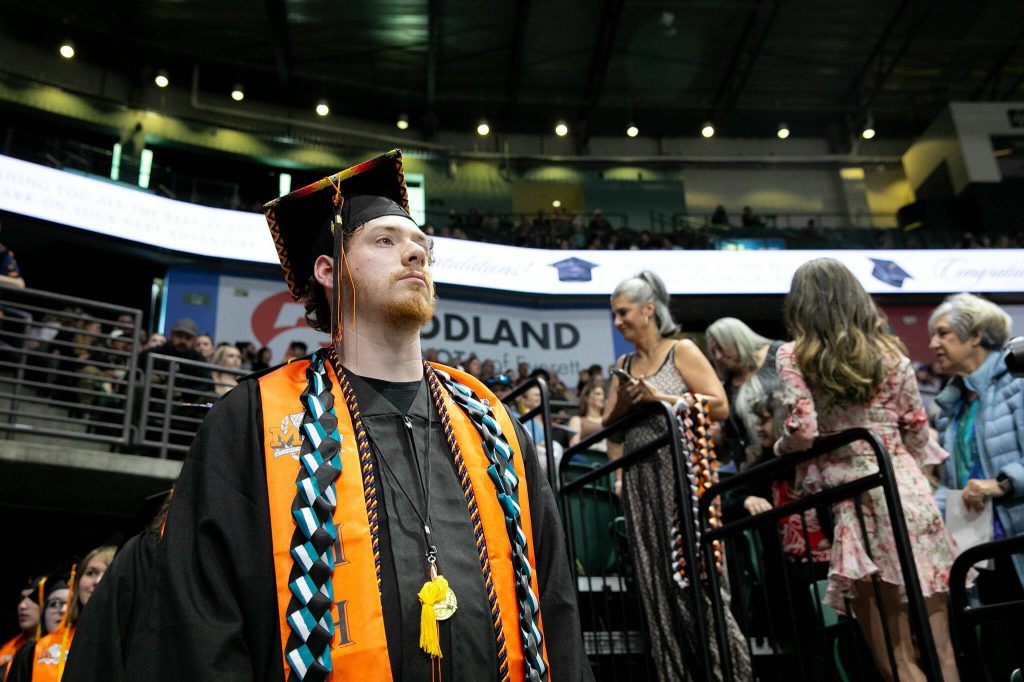 The Monroe High School class of 2024 enters the arena at the beginning of their commencement on Wednesday, June 12, 2024, at Angel of the Winds Arena in Everett, Washington. (Ryan Berry / The Herald)