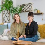 Leslie Davis (left) and her twin sister, Lyndsay Lamb, pose in the den of a house they remodeled in Snohomish, as seen on Unsellable Houses. (HGTV)
