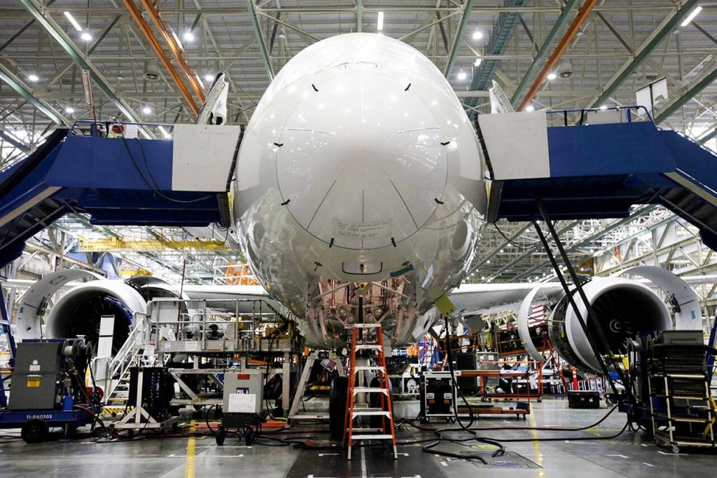 Employees work on a Boeing 787 Dreamliner during final assembly of the airplane at the Boeing Co. factory in Everett, Wash., on May 28, 2013. MUST CREDIT: Bloomberg photo by Patrick T. Fallon.