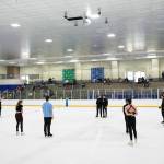 Students surround Jean-Luc Baker and Nathan Chen as they speak during the Seattle Skating Club 2024 Your True Step figure skating seminar on Saturday, June 15, 2024, at Olympic View Arena in Mountlake Terrace, Washington. (Ryan Berry / The Herald)