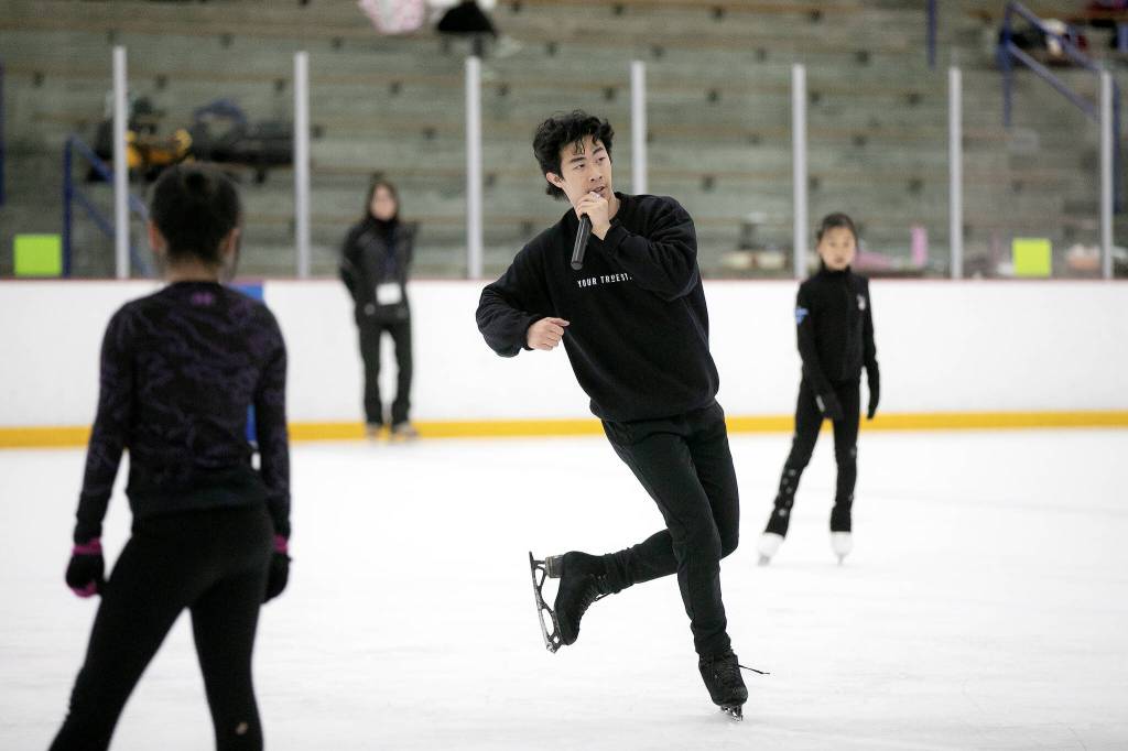 Nathan Chen speaks to his class while spinning on the ice during the Seattle Skating Club 2024 Your True Step figure skating seminar on Saturday, June 15, 2024, at Olympic View Arena in Mountlake Terrace, Washington. (Ryan Berry / The Herald)