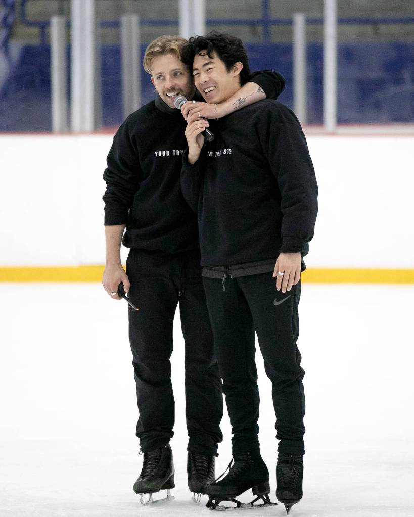 Jean-Luc Baker, left, throws his arm around Nathan Chen as the two speak to a class during the Seattle Skating Club 2024 Your True Step figure skating seminar on Saturday, June 15, 2024, at Olympic View Arena in Mountlake Terrace, Washington. (Ryan Berry / The Herald)