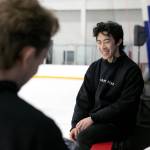 Jean-Luc Baker, left, and Nathan Chen chat between teaching lessons during the Seattle Skating Club 2024 Your True Step figure skating seminar on Saturday, June 15, 2024, at Olympic View Arena in Mountlake Terrace, Washington. (Ryan Berry / The Herald)