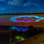 A light show at Washingtons Grand Coulee Dam dazzles at night.