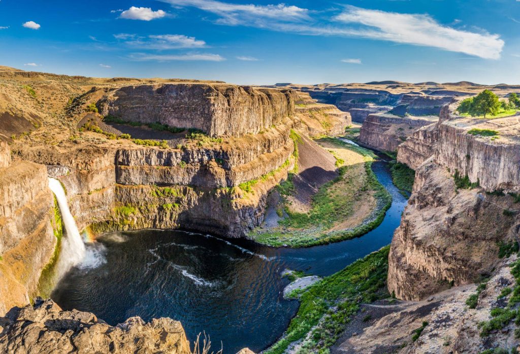 Palouse Falls State Park features a spectacular waterfall popular with artists and photography enthusiasts.