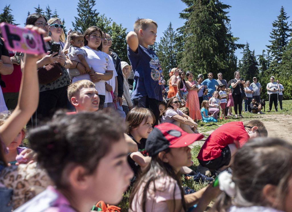 Hundreds gather to watch Oak Heights students break ground on their school project on Tuesday, June 25, 2024 in Lynnwood, Washington. (Olivia Vanni / The Herald)
