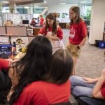 Everett Herald staff gather and talk in the newsroom after layoff announcements on Wednesday, June 19, 2024 in Everett, Washington. (Olivia Vanni / The Herald)